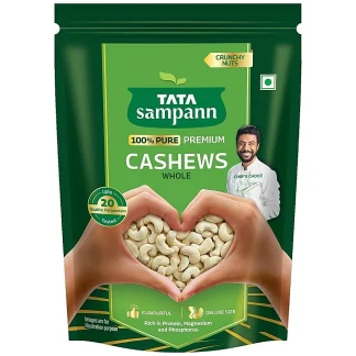 Whole raw cashew nuts in a bowl, ready to eat or cook with.