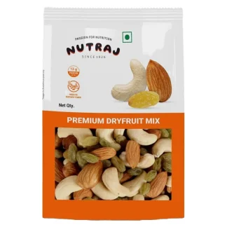 Assorted mixed dry fruits in a decorative bowl – almonds, cashews, raisins, pistachios, and walnuts.