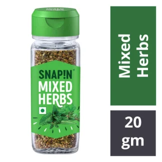 Variety of herbs and seasonings in jars and bowls – including basil, oregano, chili flakes, and mixed spices