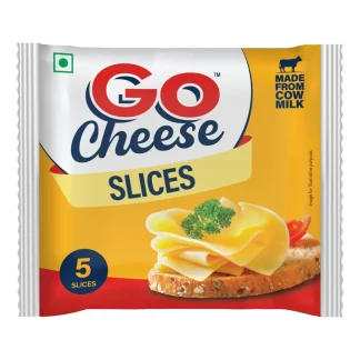 Fresh organic cow milk in a glass bottle on a wooden table.