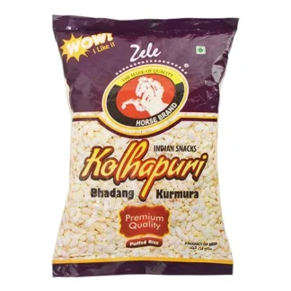 Light and crispy kurmura puffed rice in a bowl with additional puffed rice scattered around on a wooden surface.