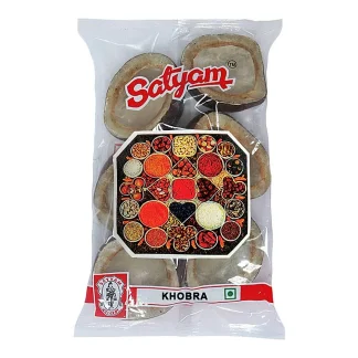 Assorted whole spices like cinnamon sticks cloves cardamom and peppercorns arranged on a wooden surface