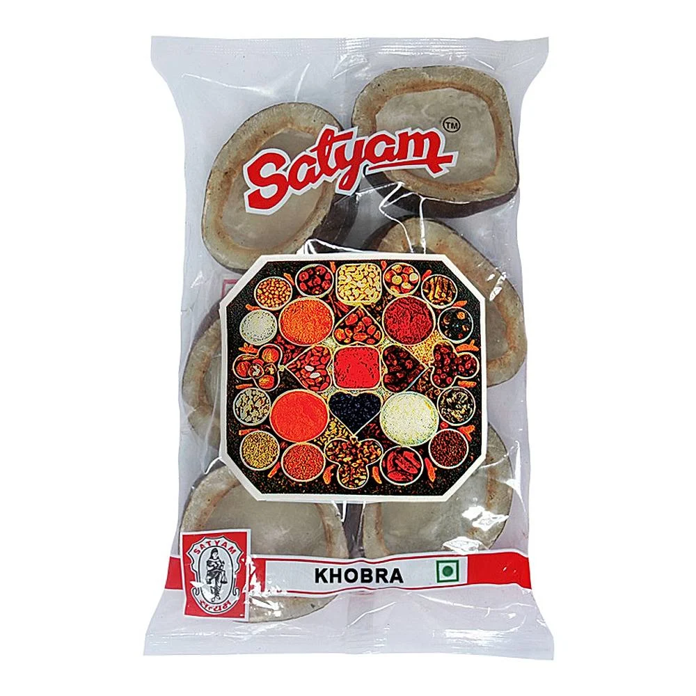 Assorted whole spices like cinnamon sticks cloves cardamom and peppercorns arranged on a wooden surface