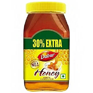 Pure natural honey in glass jars with a wooden honey dipper, surrounded by honeycomb pieces on a rustic table.