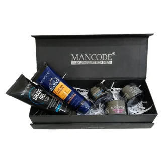 Men’s grooming products including shaving tools, skincare, hair styling items, and deodorants arranged neatly on a bathroom counter.