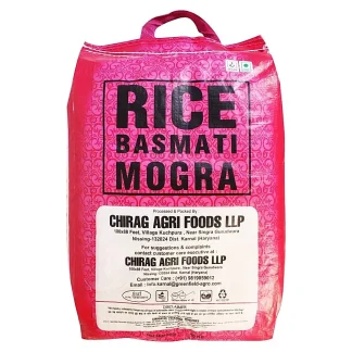 Assorted varieties of rice in bowls including basmati and white rice on a wooden surface